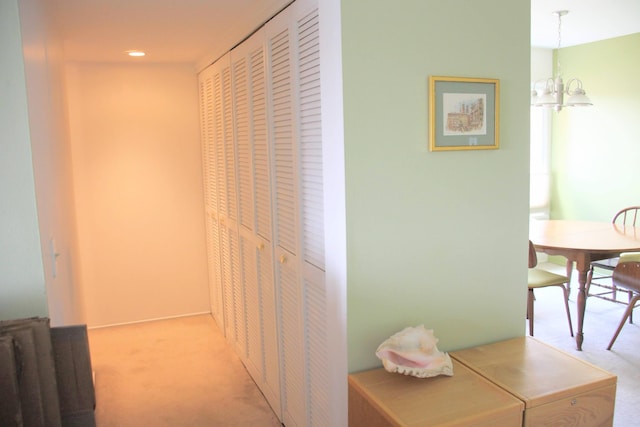 1265 S Maple Rd Unit 207, Ann Arbor, MI 48103 - hall with light colored carpet, a chandelier, and recessed lighting