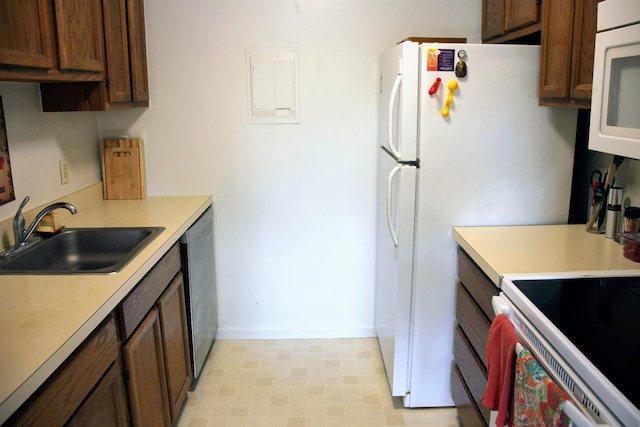 1265 S Maple Rd Unit 207, Ann Arbor, MI 48103 - kitchen featuring white appliances and light countertops