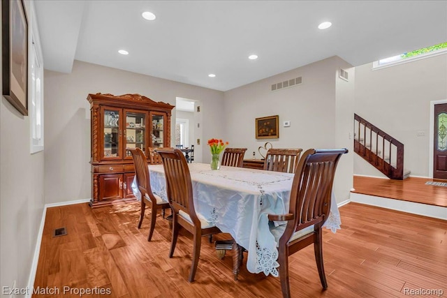 3742 Hearthstone Dr, Commerce Twp, MI 48382 - dining space with light wood-style flooring, recessed lighting, and stairway