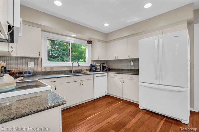 3742 Hearthstone Dr, Commerce Twp, MI 48382 - kitchen with white appliances, light wood-style flooring, decorative backsplash, white cabinets, and recessed lighting