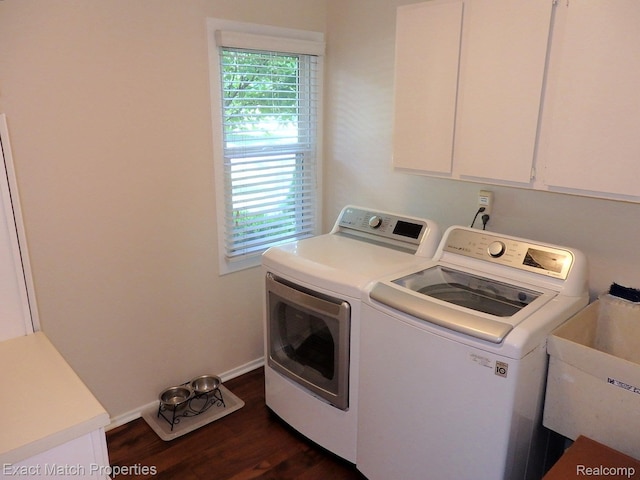 3742 Hearthstone Dr, Commerce Twp, MI 48382 - laundry room featuring washing machine and clothes dryer, cabinet space, and dark wood-type flooring