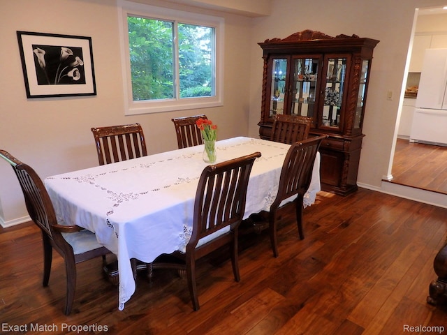 3742 Hearthstone Dr, Commerce Twp, MI 48382 - dining area featuring baseboards and dark wood-style floors