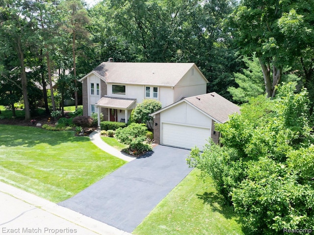 3742 Hearthstone Dr, Commerce Twp, MI 48382 - traditional home with asphalt driveway, brick siding, a garage, a front yard, and a chimney