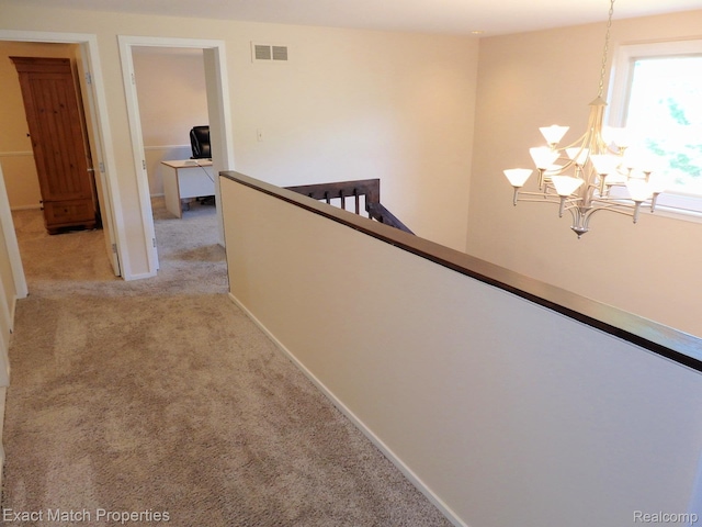 3742 Hearthstone Dr, Commerce Twp, MI 48382 - hallway with a chandelier, an upstairs landing, and light carpet