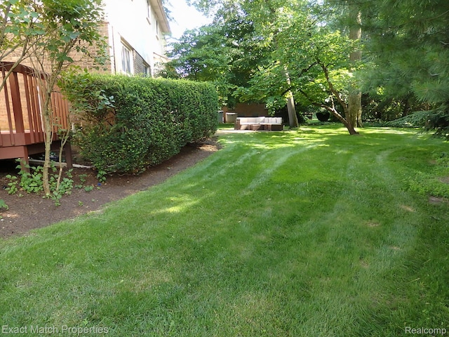 3742 Hearthstone Dr, Commerce Twp, MI 48382 - view of green lawn with a wooden deck