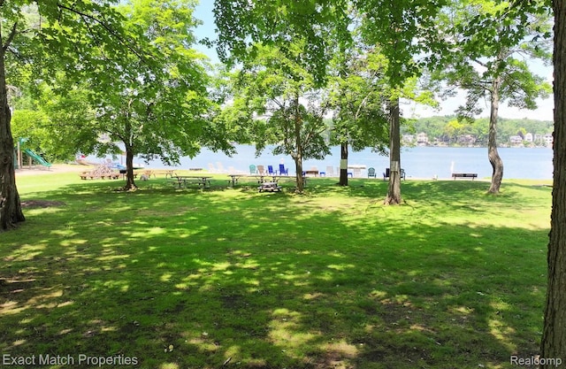 3742 Hearthstone Dr, Commerce Twp, MI 48382 - view of community with a yard and a water view
