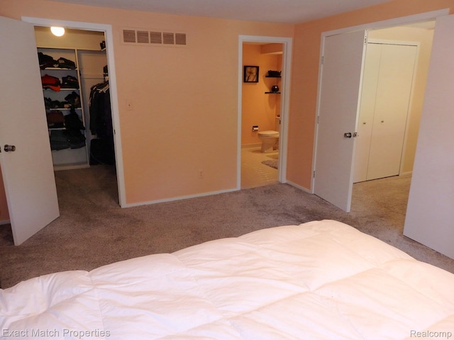 3742 Hearthstone Dr, Commerce Twp, MI 48382 - unfurnished bedroom with a spacious closet, carpet floors, and ensuite bathroom