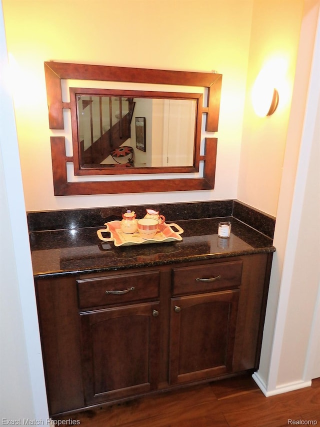 3742 Hearthstone Dr, Commerce Twp, MI 48382 - bathroom featuring wood finished floors and vanity