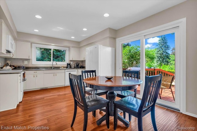3742 Hearthstone Dr, Commerce Twp, MI 48382 - dining area featuring light wood-style floors, healthy amount of natural light, and recessed lighting
