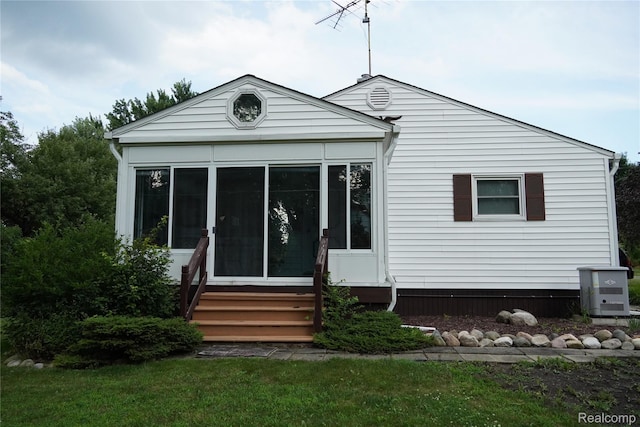 1295 Hadley Rd, Lapeer, MI 48446 - rear view of property featuring a sunroom and entry steps