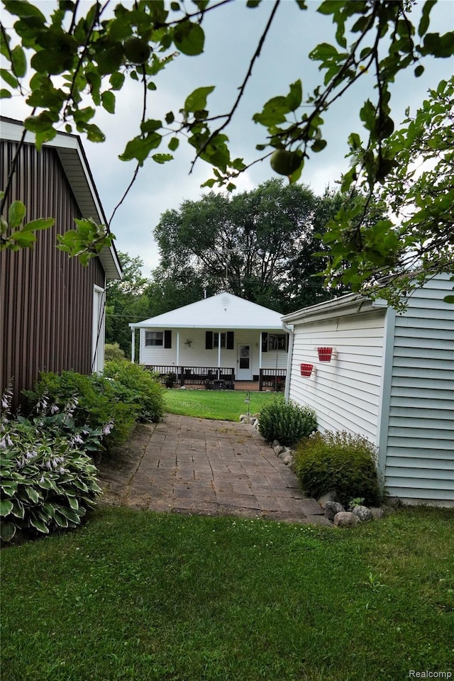 1295 Hadley Rd, Lapeer, MI 48446 - view of green lawn with a patio
