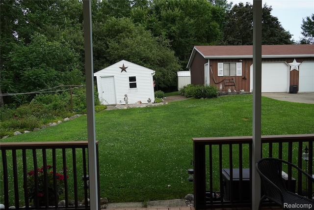 1295 Hadley Rd, Lapeer, MI 48446 - view of green lawn with a garage and a shed
