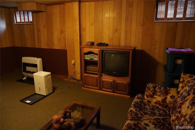 1295 Hadley Rd, Lapeer, MI 48446 - carpeted living area with wooden walls, heating unit, and a wood stove