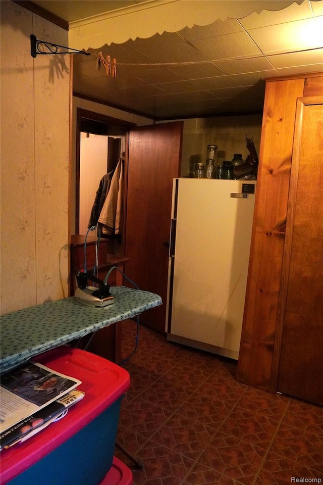 1295 Hadley Rd, Lapeer, MI 48446 - kitchen with freestanding refrigerator and wood walls