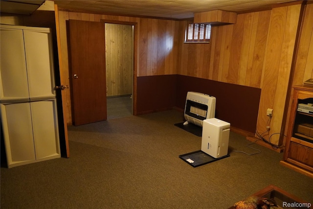 1295 Hadley Rd, Lapeer, MI 48446 - below grade area with heating unit, wood walls, and carpet floors