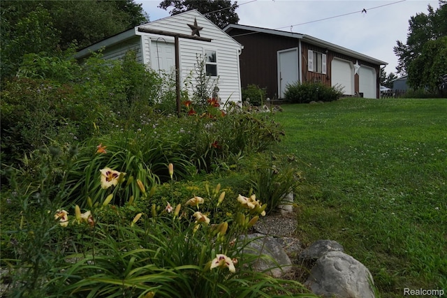 1295 Hadley Rd, Lapeer, MI 48446 - view of home's exterior with an outbuilding, a yard, and a detached garage