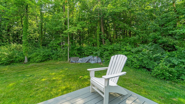 2816 Niles Buchanan Rd, Buchanan, MI 49107 - view of grassy yard featuring a wooden deck and a wooded view
