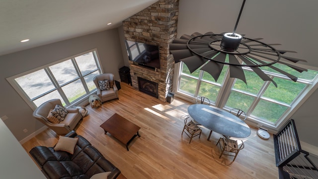 2816 Niles Buchanan Rd, Buchanan, MI 49107 - living area featuring light wood finished floors, a fireplace, plenty of natural light, vaulted ceiling, and recessed lighting