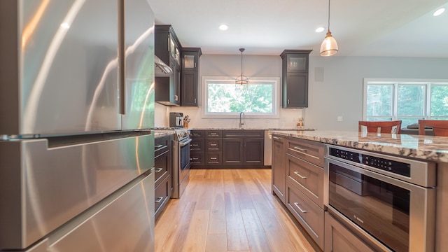 2816 Niles Buchanan Rd, Buchanan, MI 49107 - kitchen with stainless steel appliances, plenty of natural light, light wood-type flooring, recessed lighting, and light stone counters
