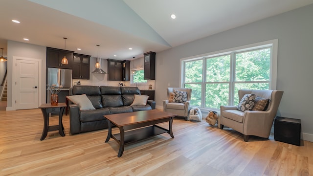 2816 Niles Buchanan Rd, Buchanan, MI 49107 - living room featuring light wood finished floors, lofted ceiling, recessed lighting, and stairs