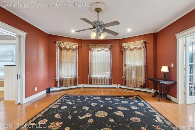 305 E 6th St, Monroe, MI 48161 - unfurnished room featuring a ceiling fan, wood finished floors, ornamental molding, recessed lighting, and a baseboard heating unit