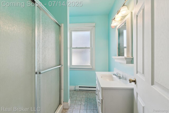 305 E 6th St, Monroe, MI 48161 - bathroom featuring a baseboard radiator, a stall shower, vanity, and tile patterned floors