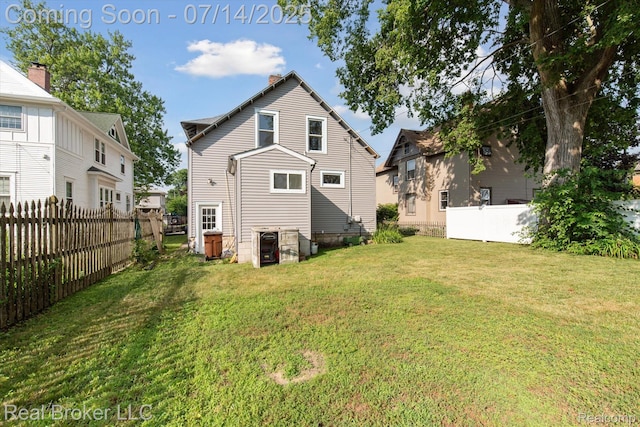 305 E 6th St, Monroe, MI 48161 - rear view of house featuring a chimney