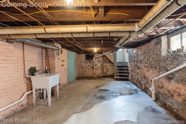 305 E 6th St, Monroe, MI 48161 - below grade area featuring stairs and a sink