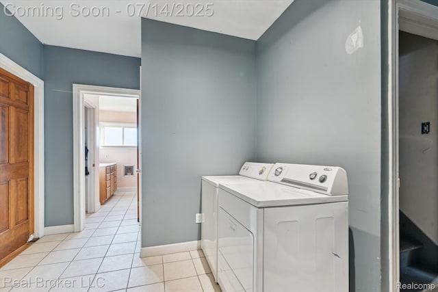 305 E 6th St, Monroe, MI 48161 - laundry area featuring washing machine and clothes dryer and light tile patterned floors