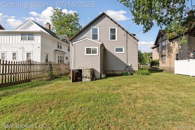 305 E 6th St, Monroe, MI 48161 - back of property featuring a fenced backyard