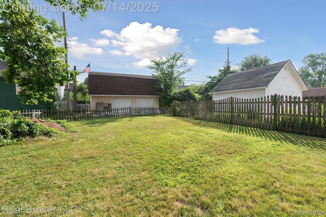 305 E 6th St, Monroe, MI 48161 - fenced yard with a garage
