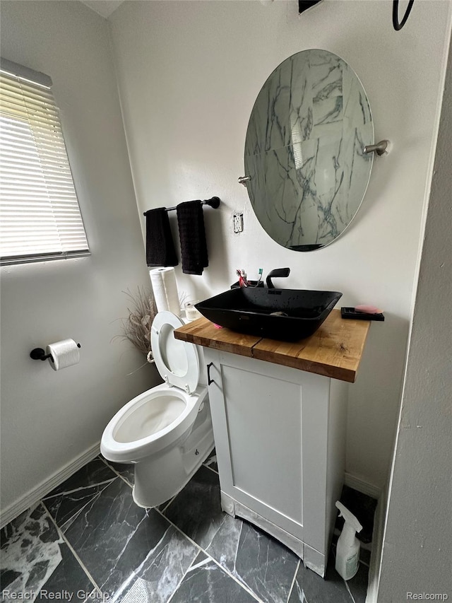 20245 Archdale St, Detroit, MI 48235 - half bathroom featuring vanity and marble look tiles