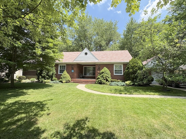 19061 Collinson Ave, Eastpointe, MI 48021 - ranch-style house with covered porch, brick siding, and a front lawn