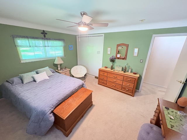 19061 Collinson Ave, Eastpointe, MI 48021 - bedroom featuring light carpet, ceiling fan, and a closet