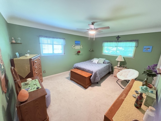19061 Collinson Ave, Eastpointe, MI 48021 - bedroom with multiple windows, light carpet, and a ceiling fan