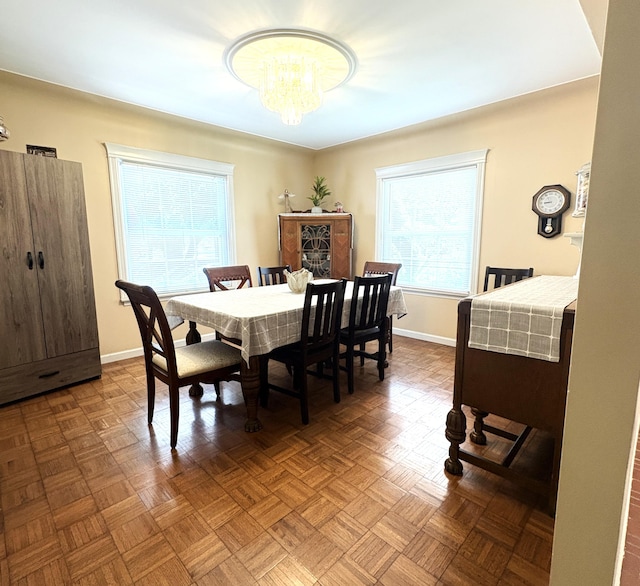19061 Collinson Ave, Eastpointe, MI 48021 - dining space featuring a chandelier and baseboards