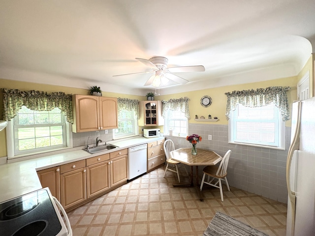19061 Collinson Ave, Eastpointe, MI 48021 - kitchen featuring white appliances, light brown cabinets, tile walls, light countertops, and a wainscoted wall