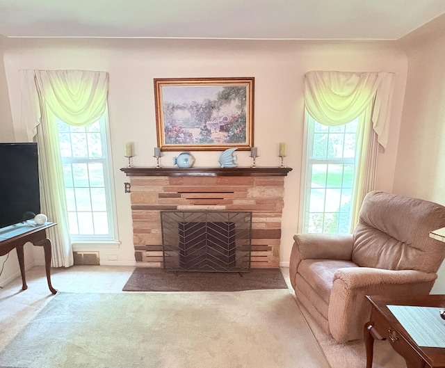 19061 Collinson Ave, Eastpointe, MI 48021 - carpeted living room featuring a stone fireplace