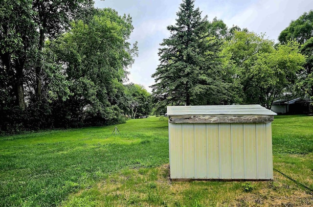 5955 N Pendell Rd, Elwell, MI 48832 - view of grassy yard with a storage shed