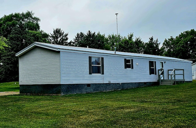 5955 N Pendell Rd, Elwell, MI 48832 - view of front of home with crawl space, a front lawn, a metal roof, and view of scattered trees