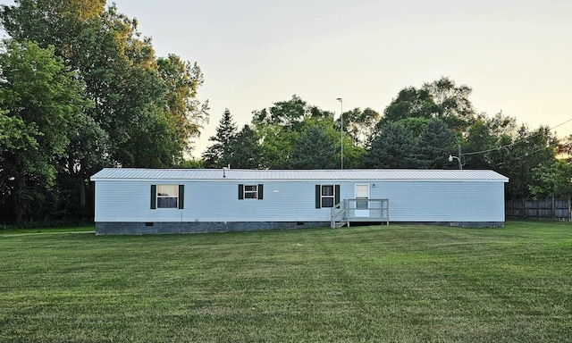 5955 N Pendell Rd, Elwell, MI 48832 - rear view of property featuring crawl space and a yard