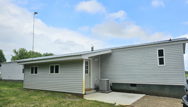 5955 N Pendell Rd, Elwell, MI 48832 - back of property featuring crawl space, a metal roof, and a yard