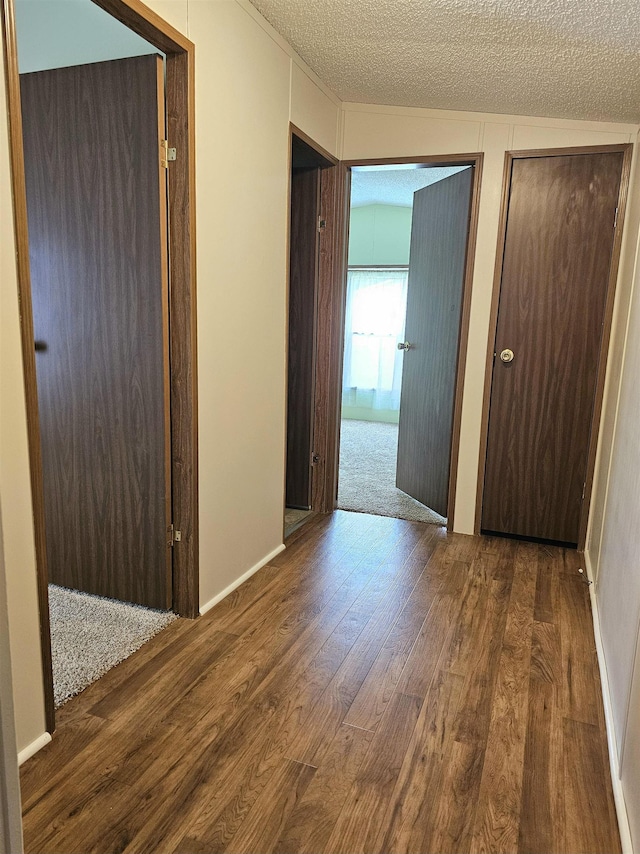 5955 N Pendell Rd, Elwell, MI 48832 - hallway with wood finished floors and a textured ceiling