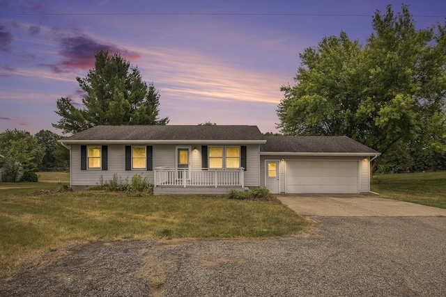 13280 Bradshaw St NE, Gowen, MI 49326 - single story home with driveway, a porch, a yard, and an attached garage