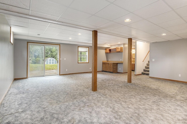 13280 Bradshaw St NE, Gowen, MI 49326 - below grade area with light colored carpet, a paneled ceiling, stairs, and recessed lighting