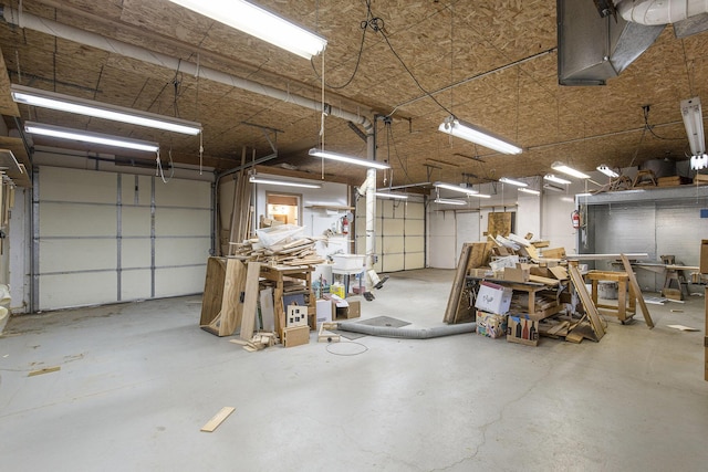 13280 Bradshaw St NE, Gowen, MI 49326 - garage featuring a workshop area