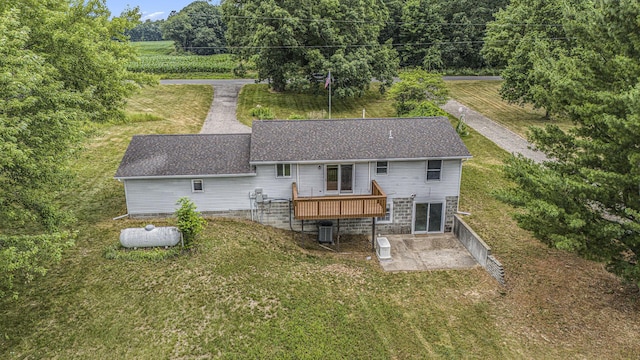 13280 Bradshaw St NE, Gowen, MI 49326 - rear view of house featuring a patio area, a deck, a yard, and roof with shingles