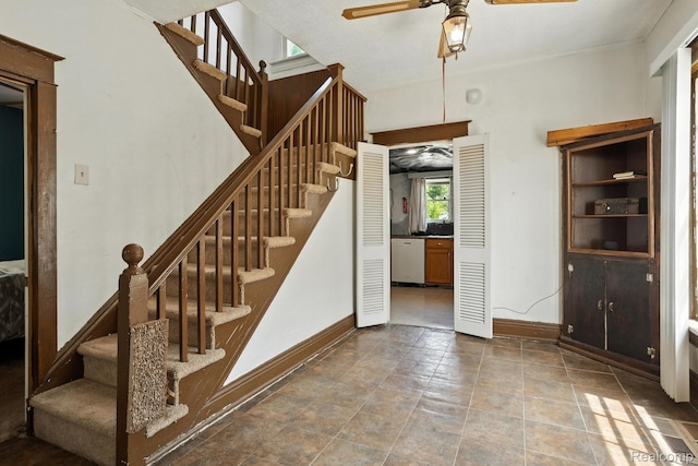 2424 10th Ave, Port Huron, MI 48060 - stairs with a ceiling fan and baseboards