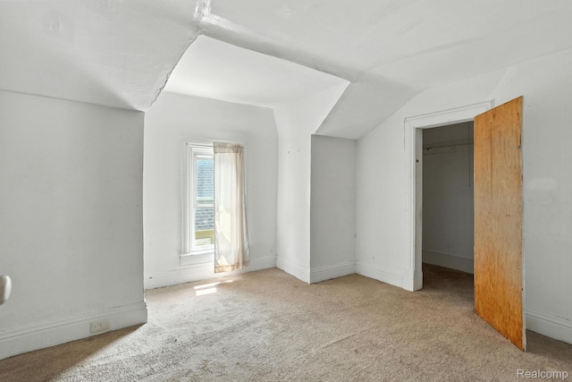 2424 10th Ave, Port Huron, MI 48060 - unfurnished bedroom with carpet and lofted ceiling