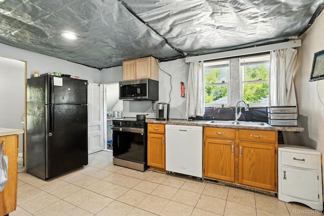 2424 10th Ave, Port Huron, MI 48060 - kitchen with freestanding refrigerator, dishwasher, stainless steel microwave, electric range, and light tile patterned floors